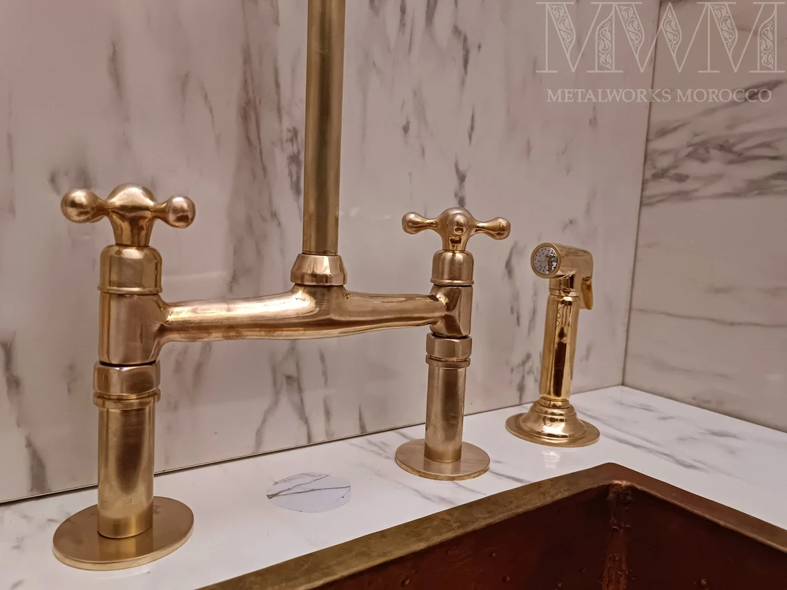 Close-up of the aged brass bridge and cross handles with side sprayer