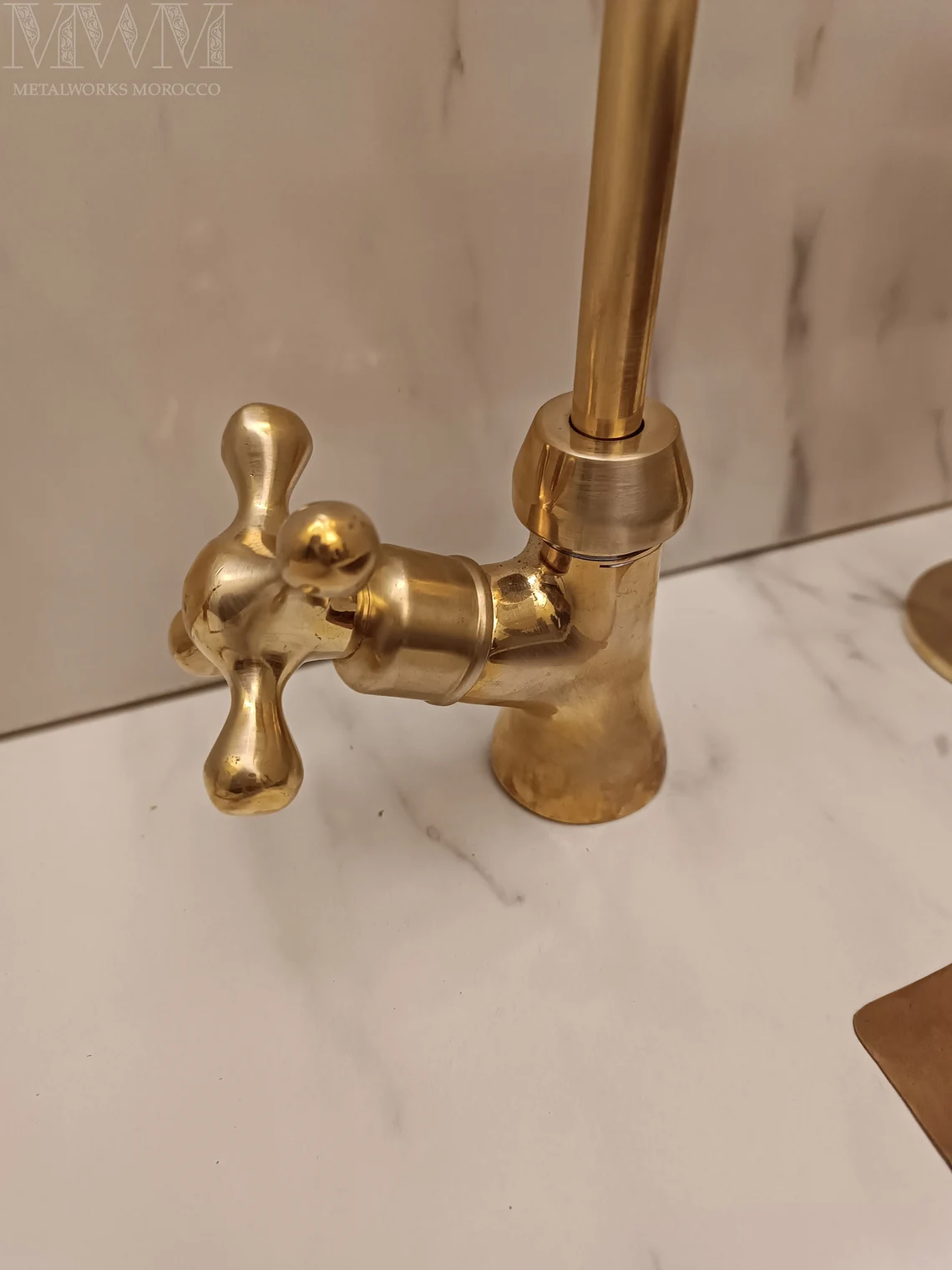 Close-up of the drinking water faucet cross handle