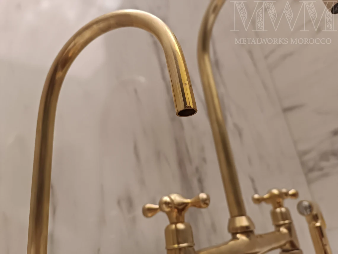 Close-up of the aged brass gooseneck spout outlet