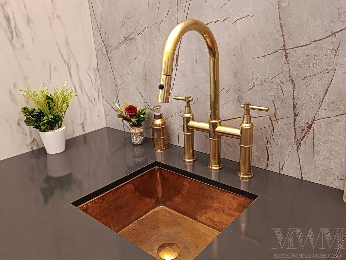 Unlacquered Brass Bridge Faucet With Pull Down Sprayer unlacquered brass patina close-up