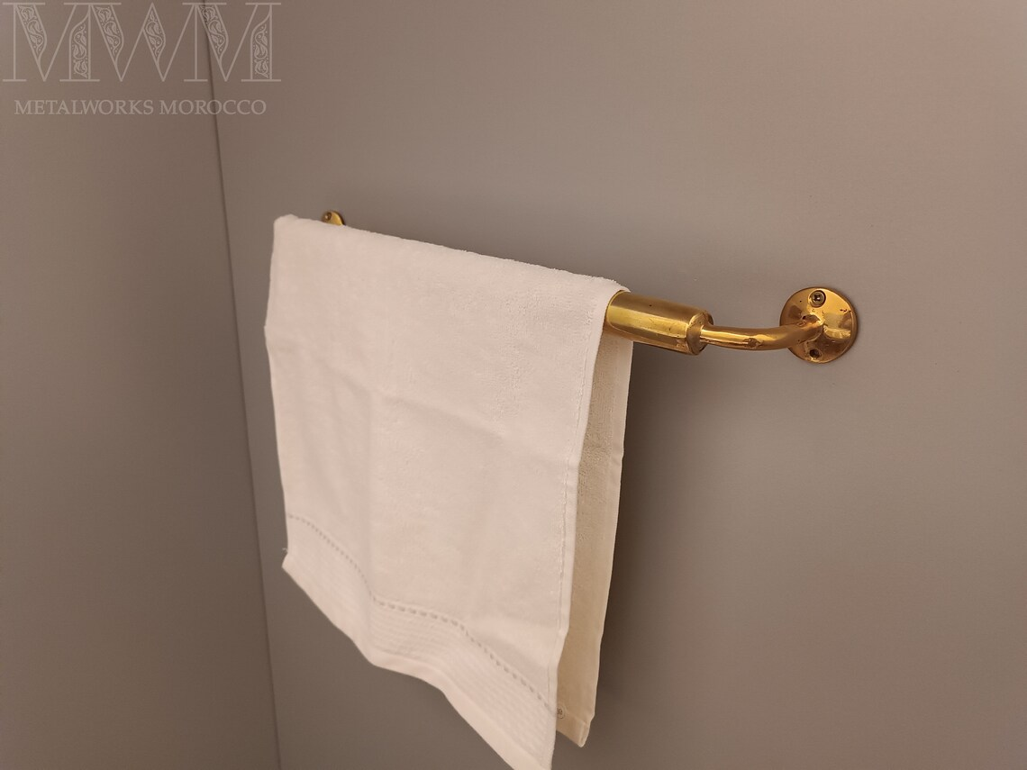 Handmade Unlacquered Brass Towel Rod Holder installed in home setting