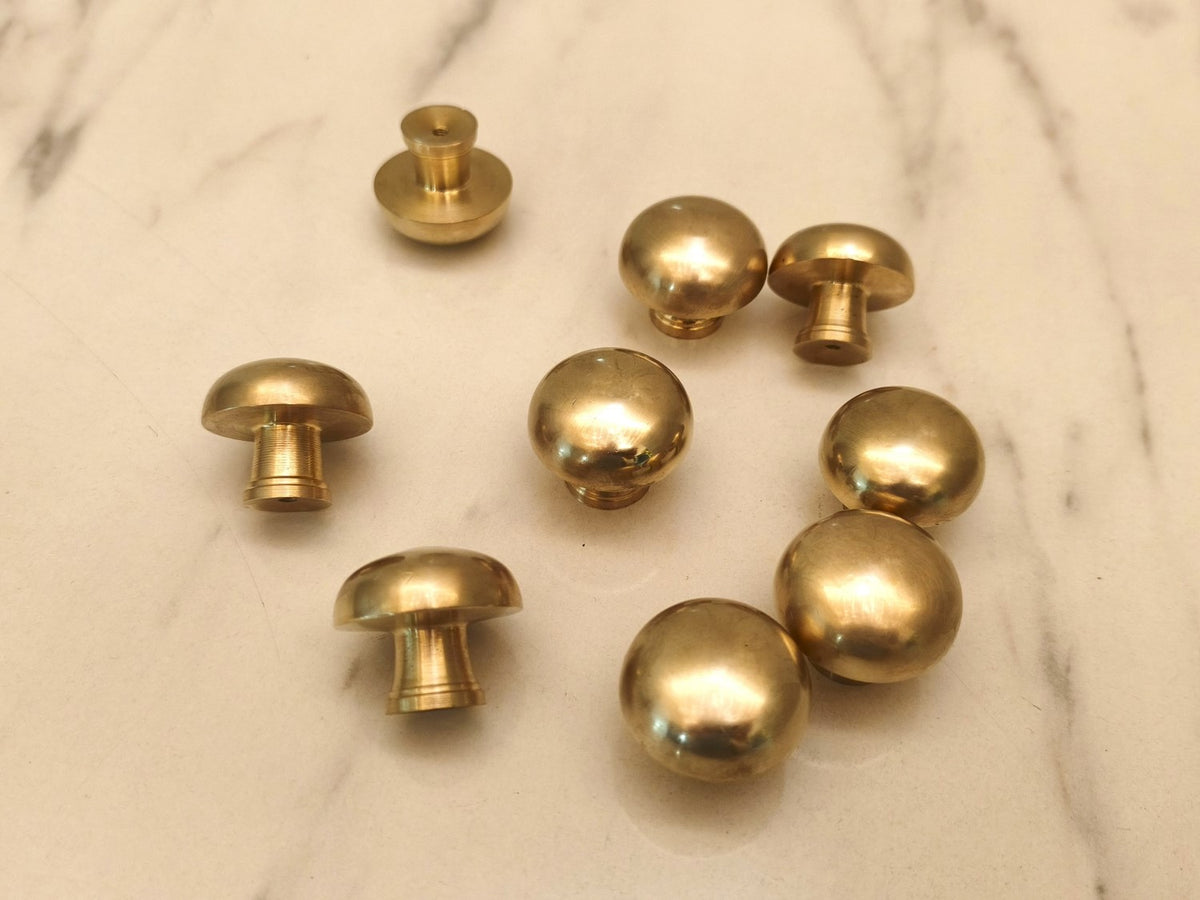 Solid brass mushroom cabinet knobs with burnished finish, front and side views